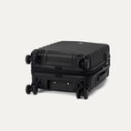 bottom view of the black travelpro maxlite air v2 suitcase showing the four 360 degree spinner wheels and the protective polycarbonate shell.