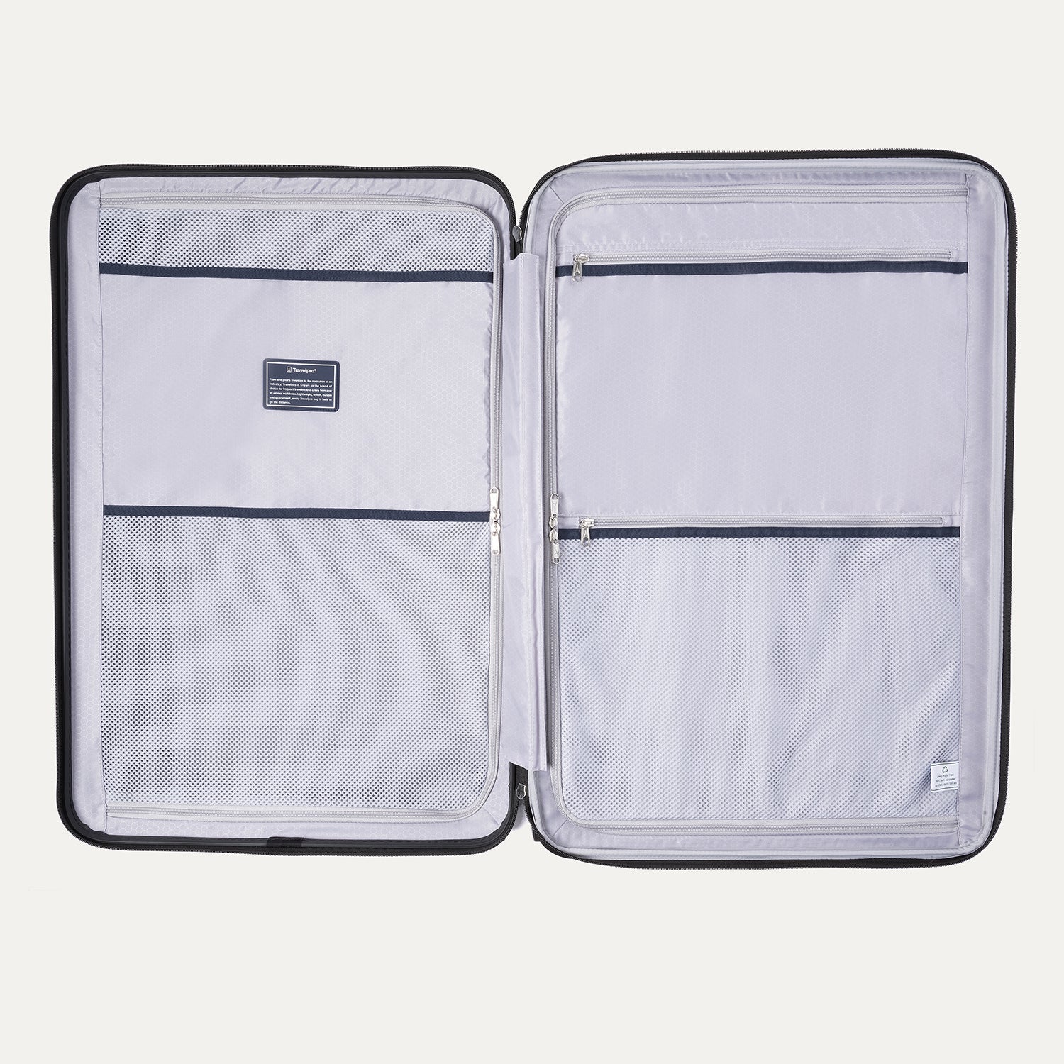 open interior of the travelpro maxlite air v2 hardside spinner, featuring two zippered divider panels and a built-in accessory pocket for organized packing.