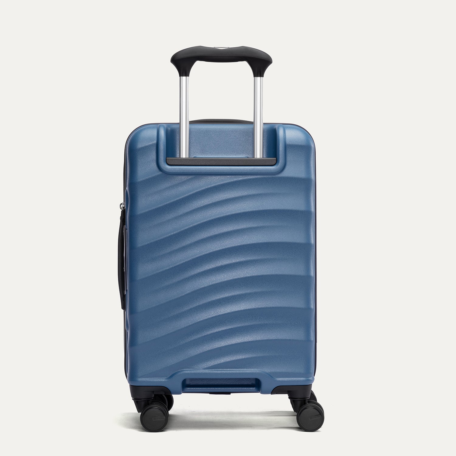 back view of the ensign blue travelpro maxlite air v2 hardside suitcase showing the textured polycarbonate shell and reinforced corner guards.