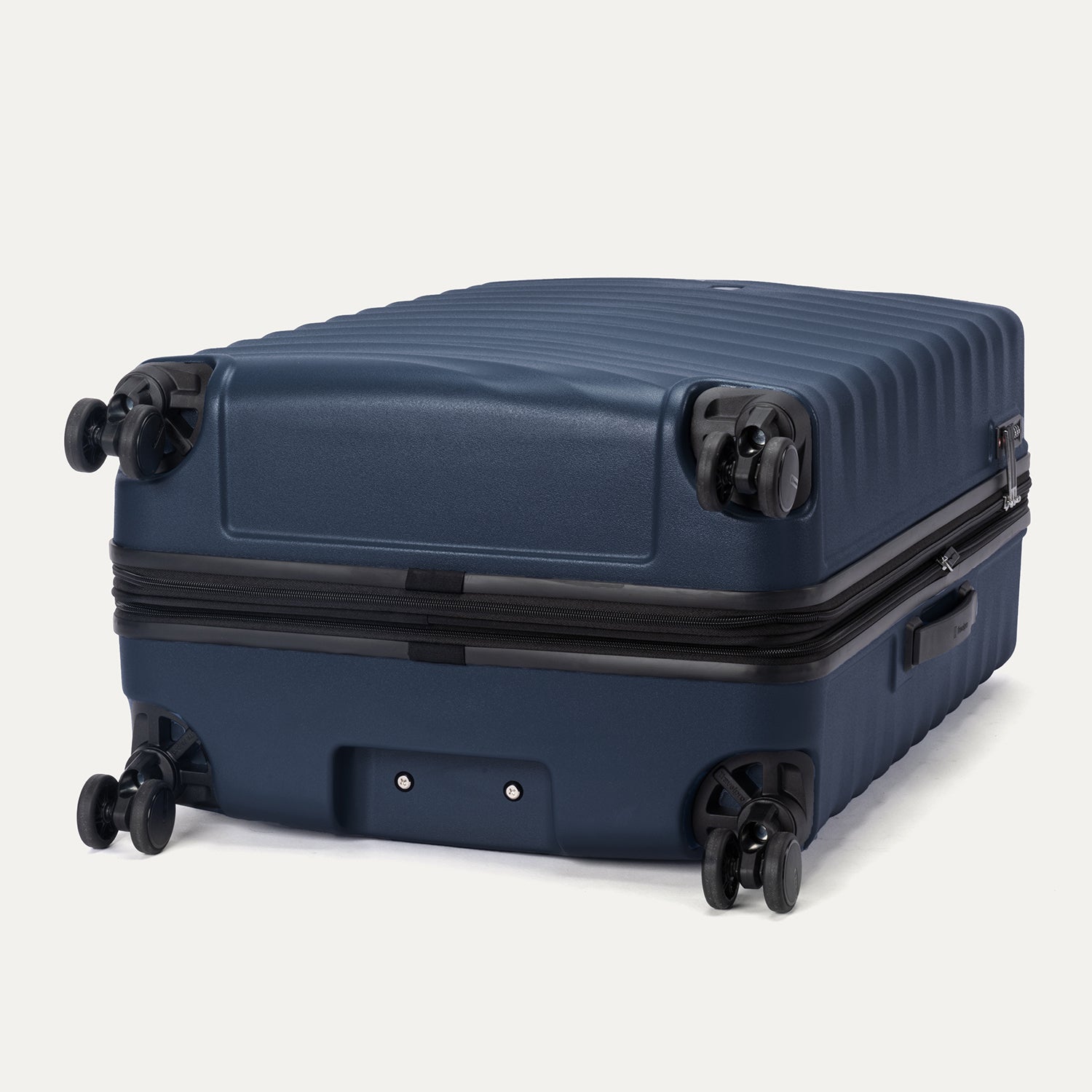 Bottom view of Travelpro Maxlite Air V2 Hardside Spinner in Midnight Blue, featuring 360° Spinner Wheels and expandable zipper.
