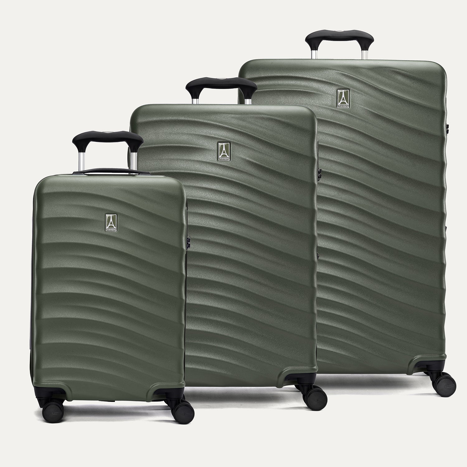 A set of three green Maxlite Air V2 hardside spinner suitcases, including carry-on, medium, and large sizes, with a textured surface and extended handle