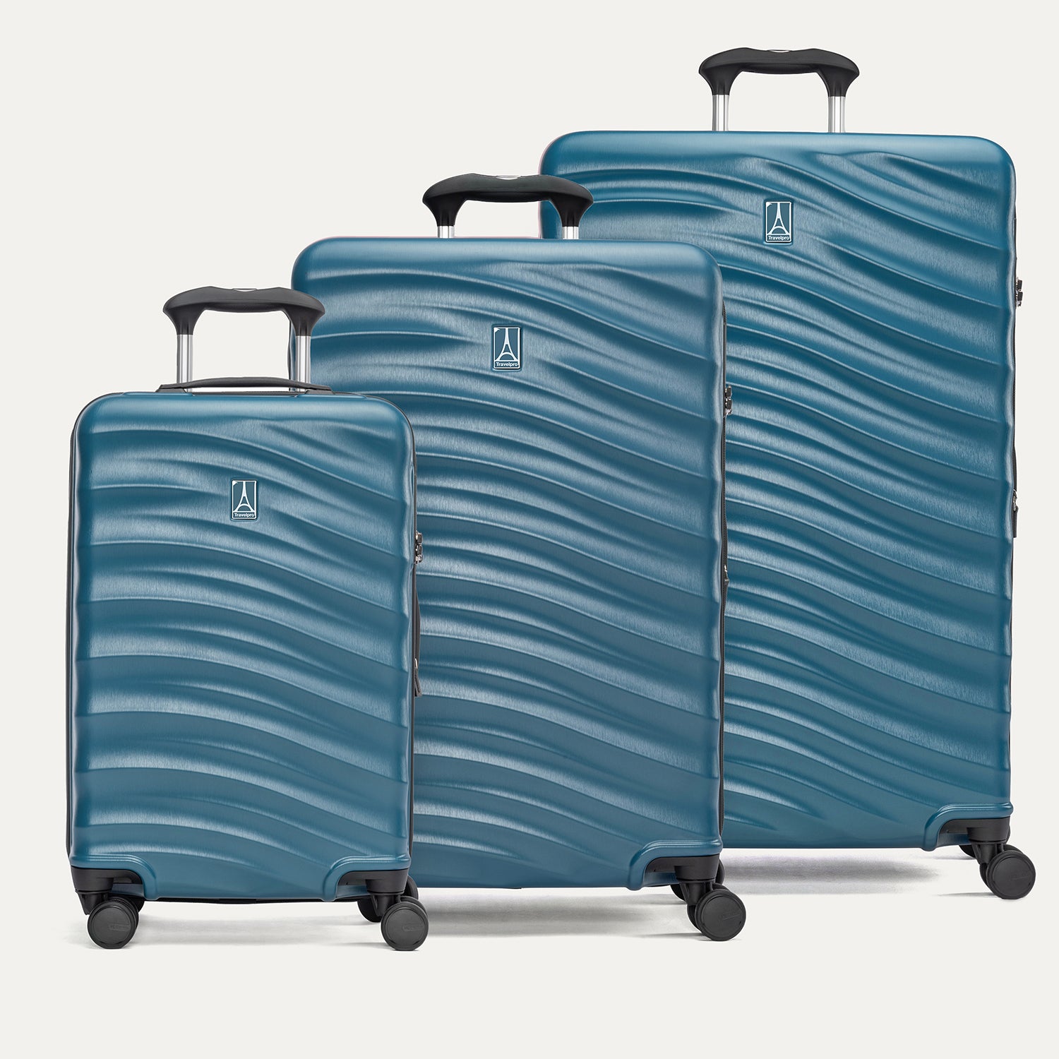 A set of three blue Maxlite Air V2 hardside spinner suitcases, including carry-on, medium, and large sizes, aligned in a row with the large suitcase at the back.
