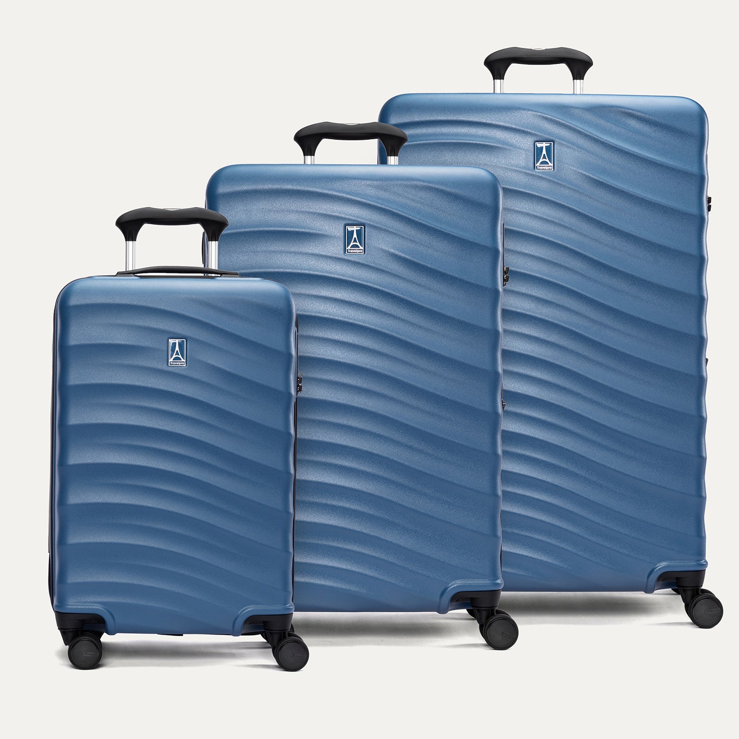 A set of three blue Maxlite Air V2 hardside spinner suitcases, including a carry-on, medium, and large sizes, aligned in a row on a white background