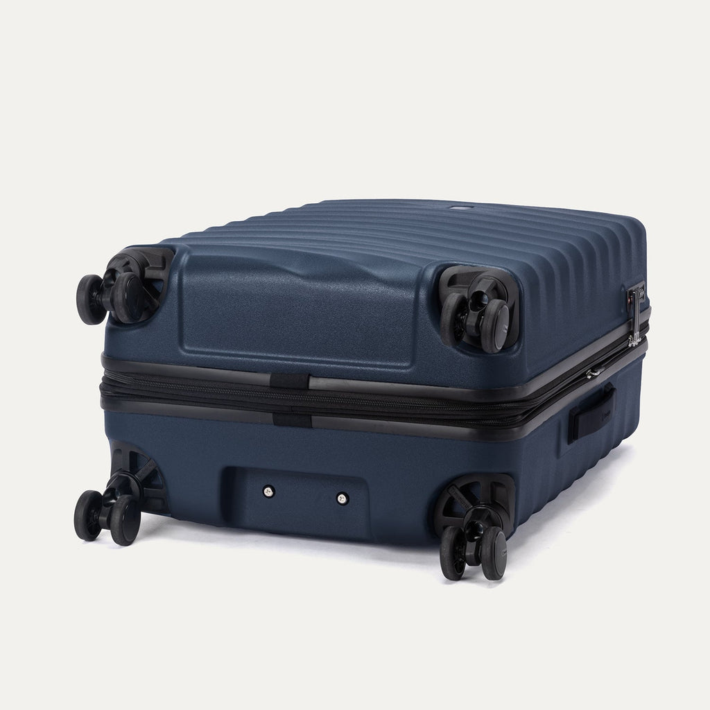 Bottom view of Travelpro Maxlite Air V2 Spinner in Midnight Blue, featuring smooth-glide 360° Spinner Wheels and stable base design.
