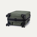 Travelpro Maxlite Air V2 Expandable Spinner in Slate Green, shown lying flat to display base and wheels.
