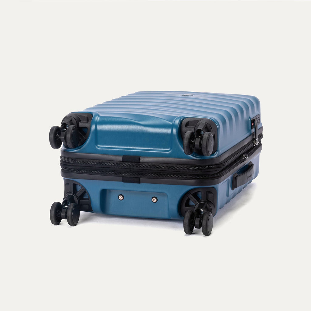 Bottom view of Travelpro Maxlite Air V2 Spinner in Teal, showing 360° Spinner Wheels and durable shell.
