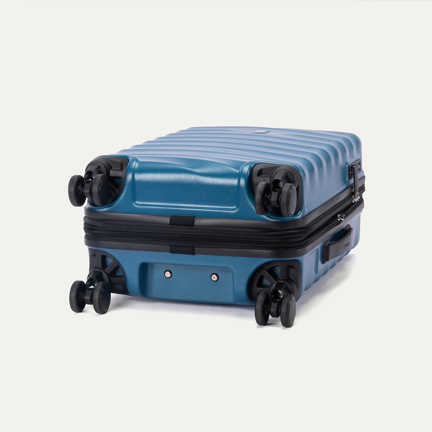 Bottom view of Travelpro Maxlite Air V2 Spinner in Teal, showing 360° Spinner Wheels and durable shell.
