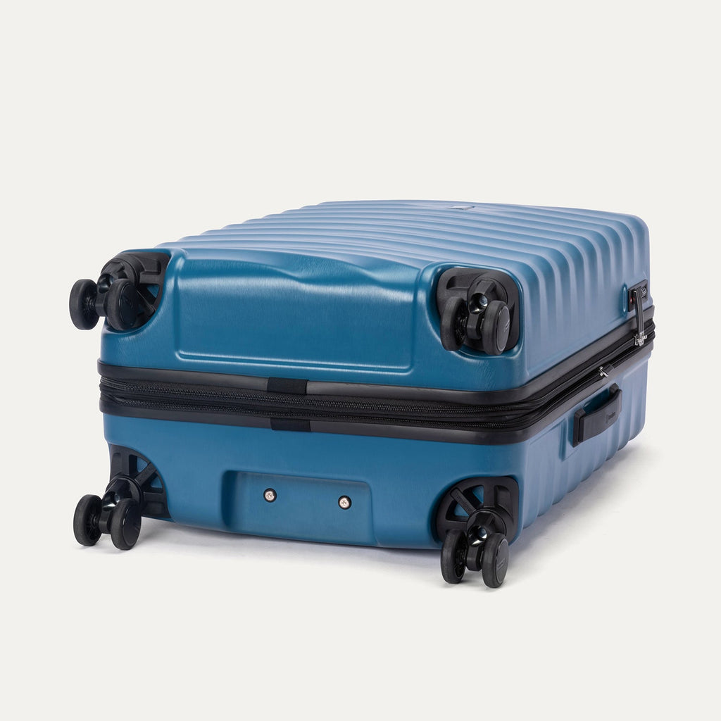 Bottom view of Travelpro Maxlite Air V2 Spinner in Teal, showing 360° Spinner Wheels and durable shell.
