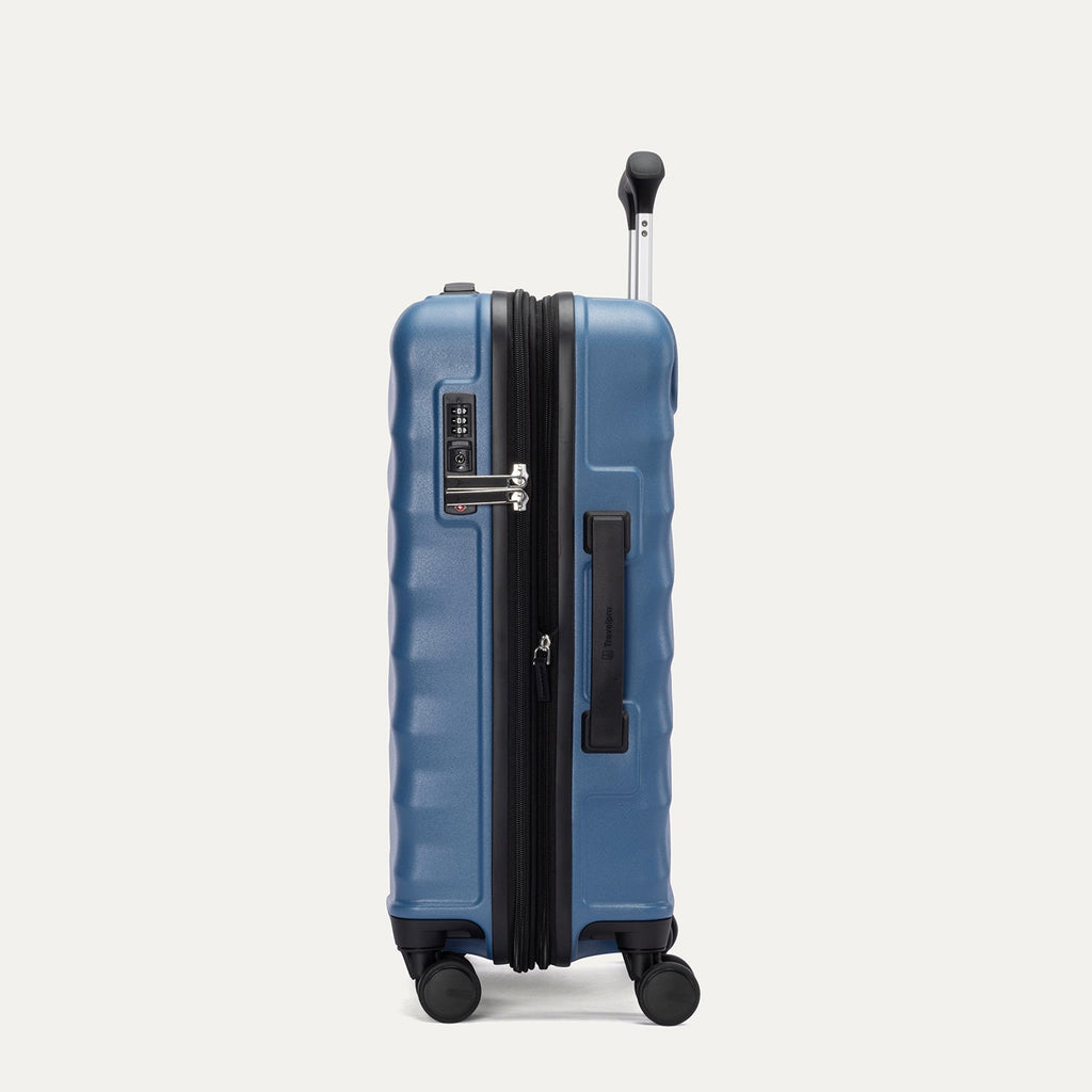 Side view of Travelpro Maxlite Air V2 Spinner in Ensign Blue, showing TSA Approved Locks and low-profile side carry handle.
