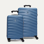 A set of two blue hardside spinner suitcases, one carry-on size and one medium check-in size, with a pattern on the shell on a white background