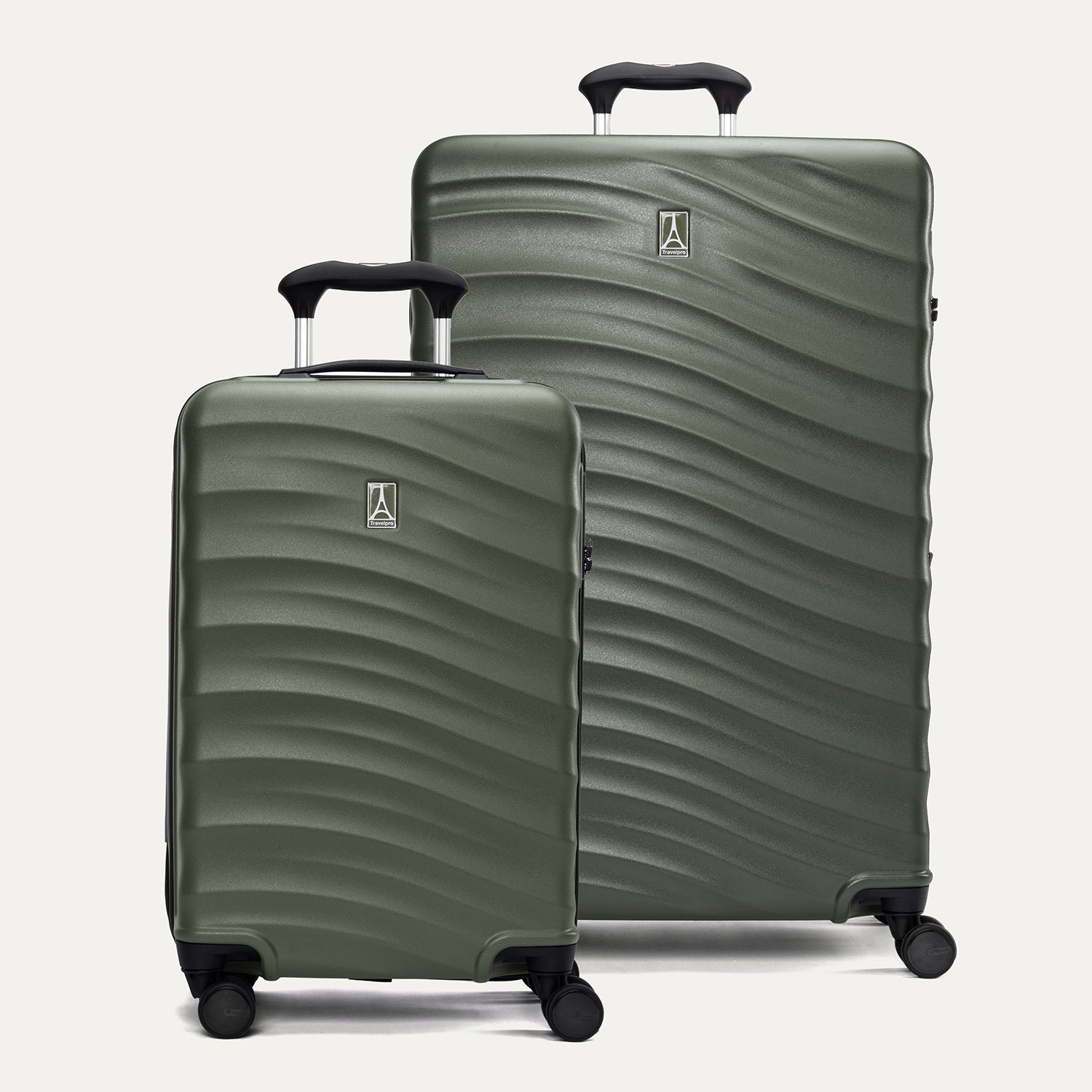 A set of two green Maxlite Air V2 hardside spinner suitcases, one carry-on size and one large check-in size, with a textured surface, integrated handles, and  wheels.