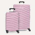 A set of two pink hardside spinner suitcases, one carry-on size and one large check-in size, with a textured surface, integrated handles, and wheels.