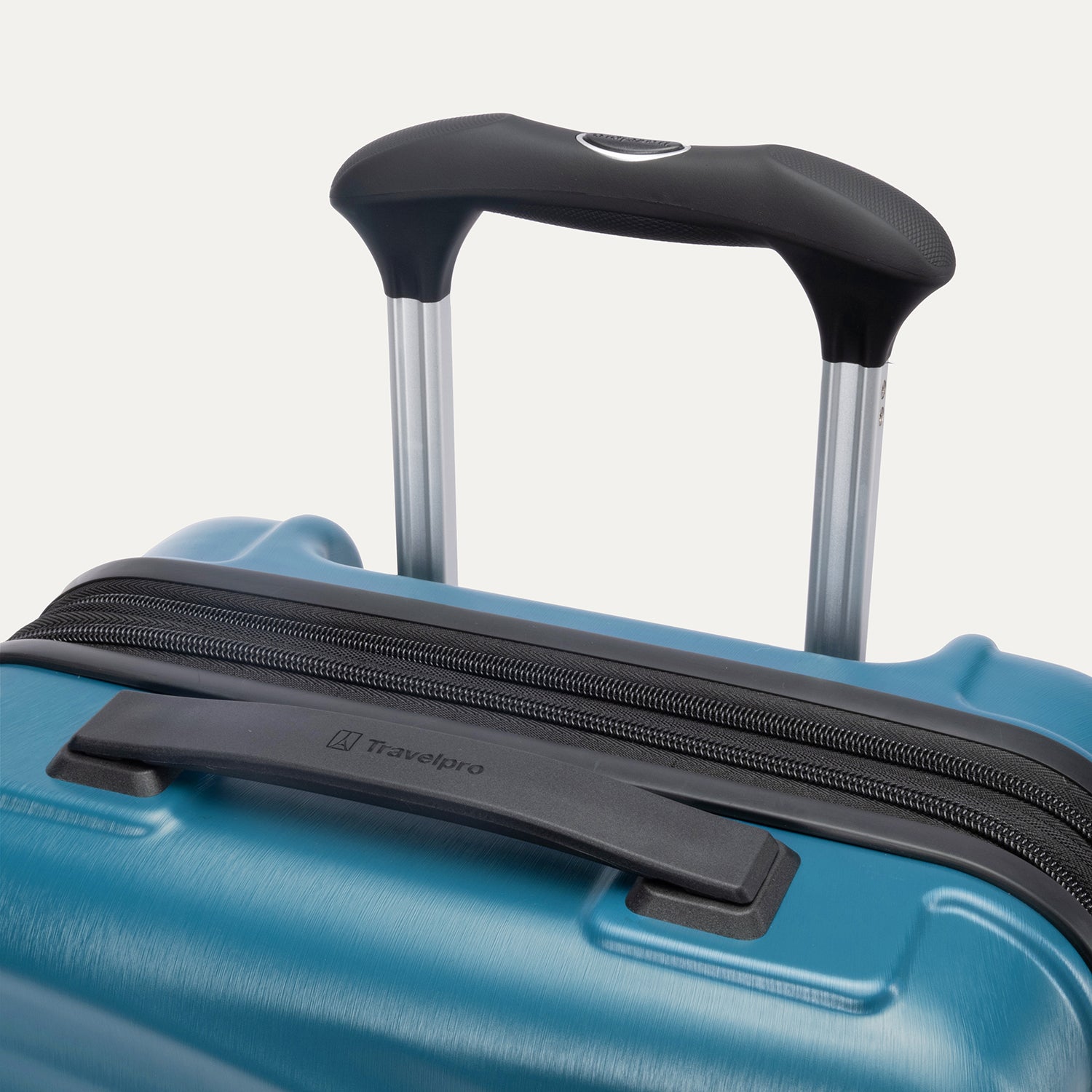 Close-up of Travelpro Maxlite Air V2 in Teal, showing PowerScope Lite Handle and low-profile top carry handle.






