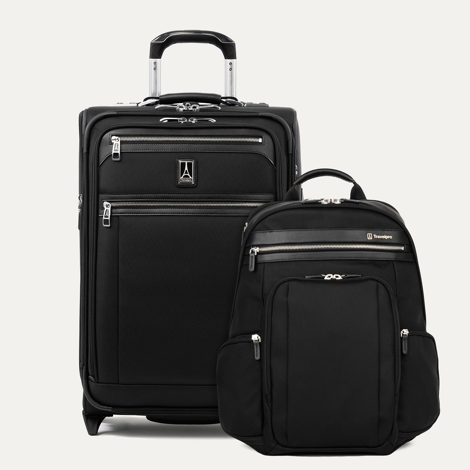 Black suitcase and backpack with visible Travelpro branding on a light gray background
