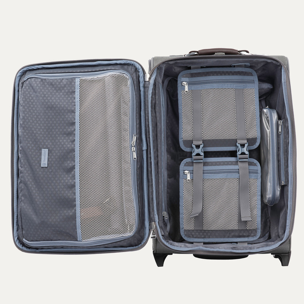Open gray suitcase with organized compartments on a white background