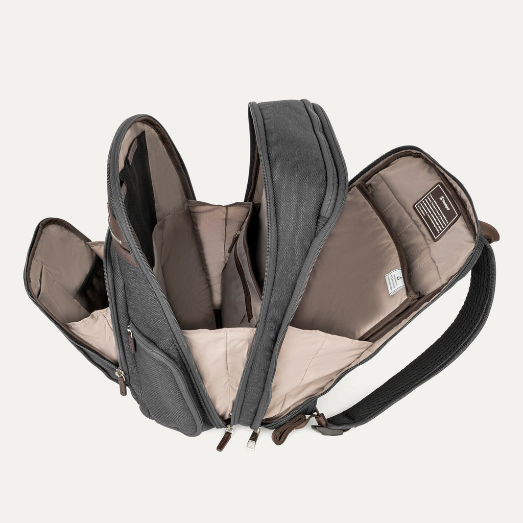 Open backpack with gray and brown interior pockets on a light beige background