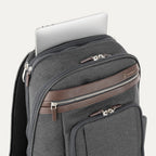 Gray backpack with a laptop compartment on a white background