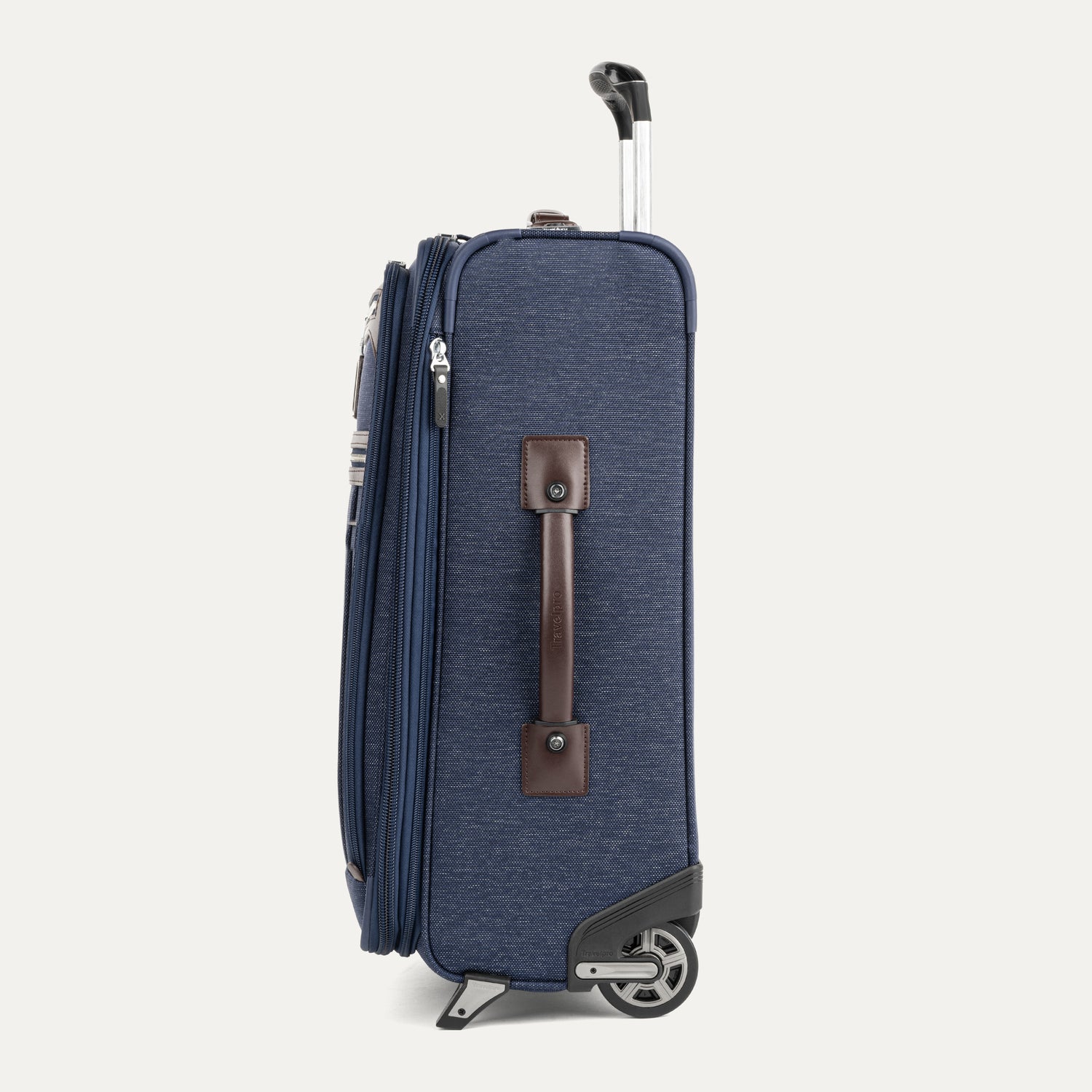 Side view Blue 2 wheel suitcase with a brown handle on a white background