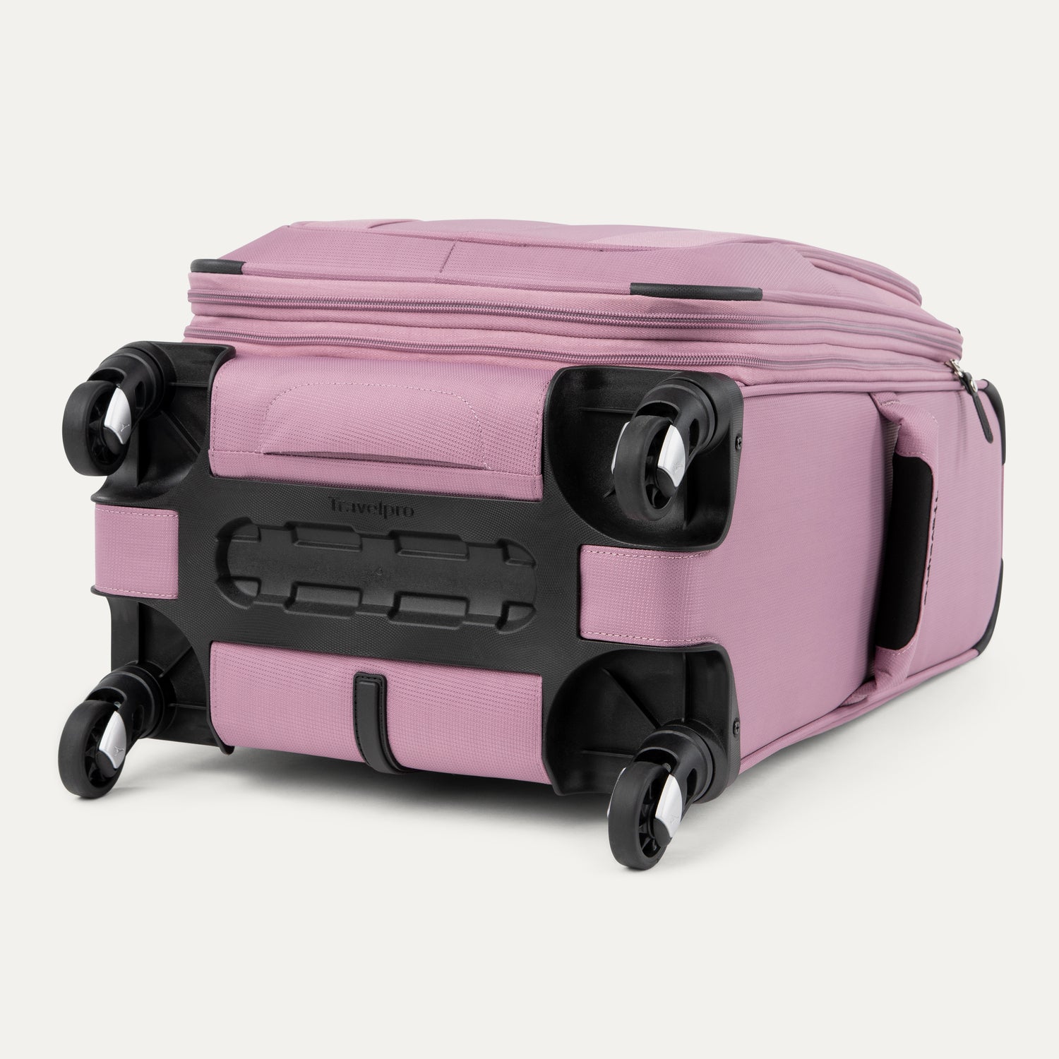 Pink suitcase with black wheels on a light gray background