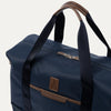 Blue weekender with brown accents on a white background