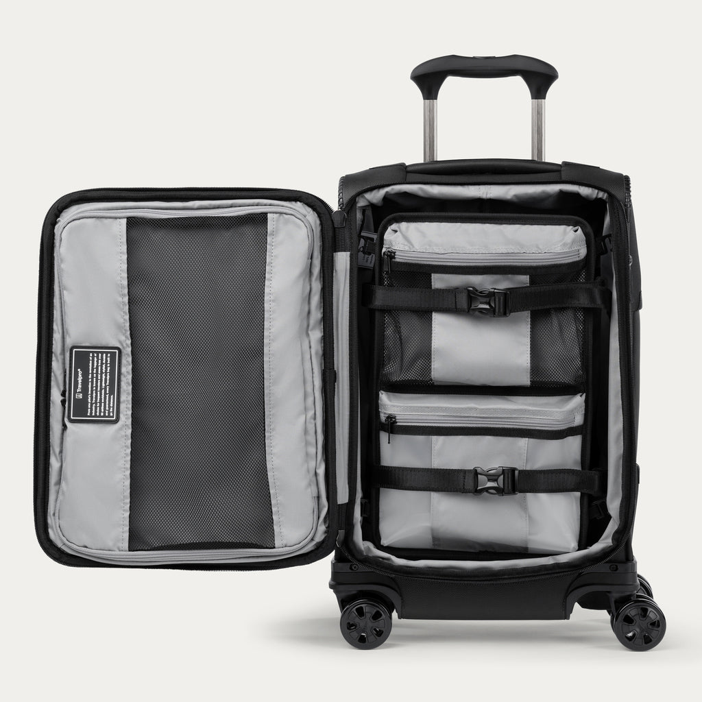 Black suitcase with open lid showing organized interior on a white background