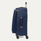 Side profile of a blue suitcase  on a white background