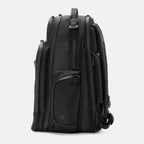 Side view of black backpack on a white background