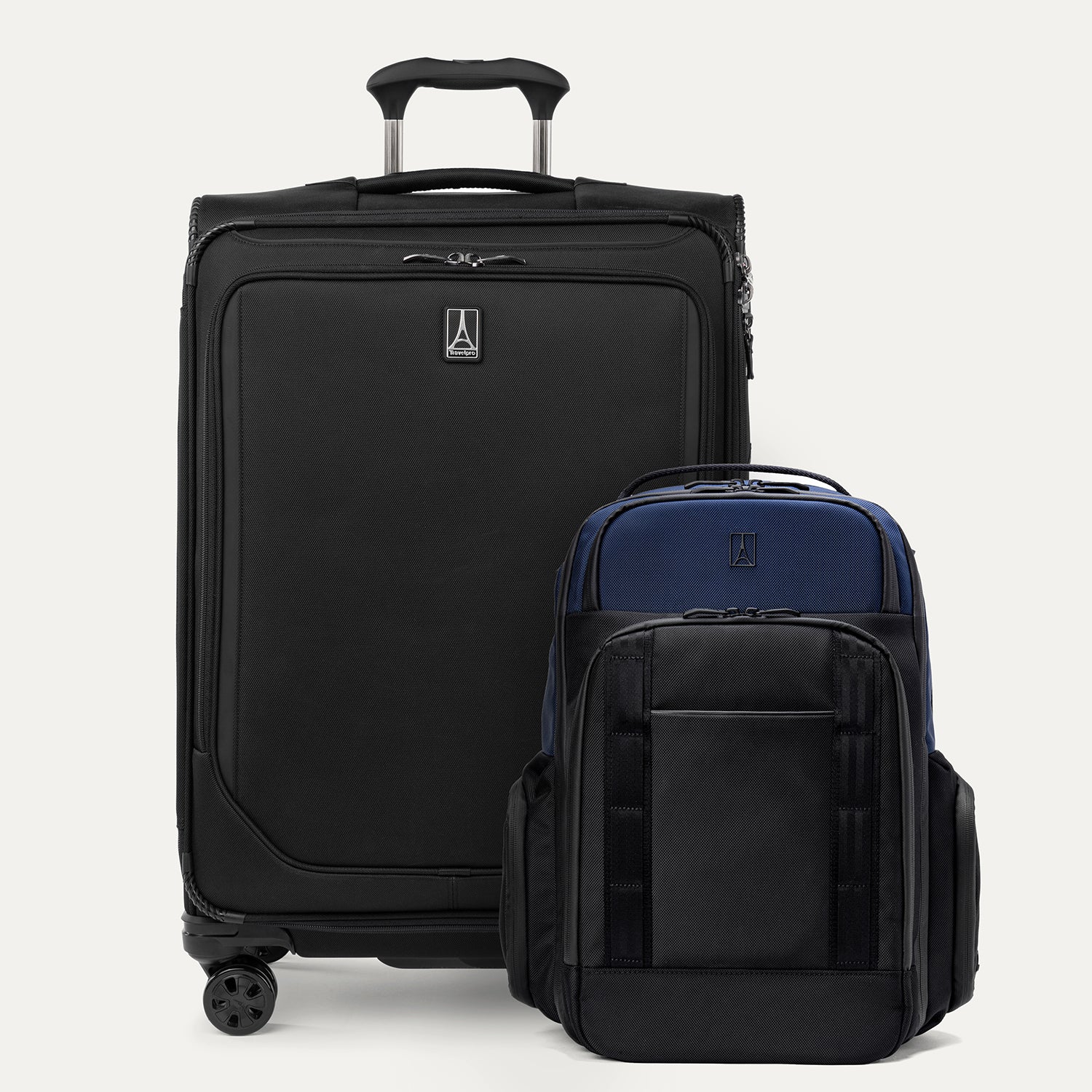 A set of two pieces of luggage, a large black spinner suitcase and a aviator navy backpack, both with the Travelpro brand logo.