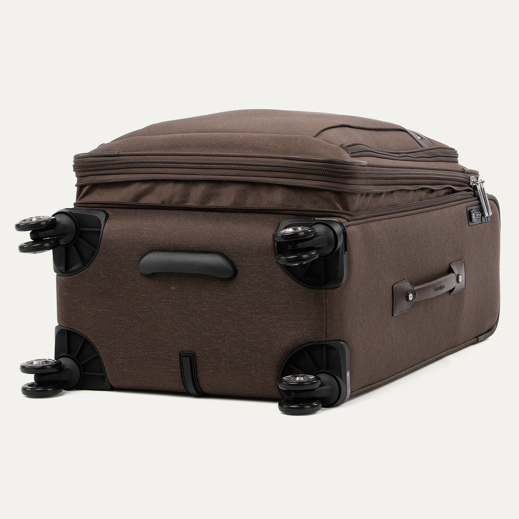 Brown suitcase with black wheels on a white background