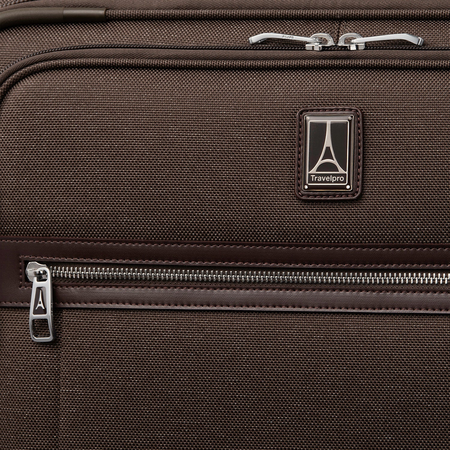 Close-up of a brown suitcase with zipper and travelpro logo