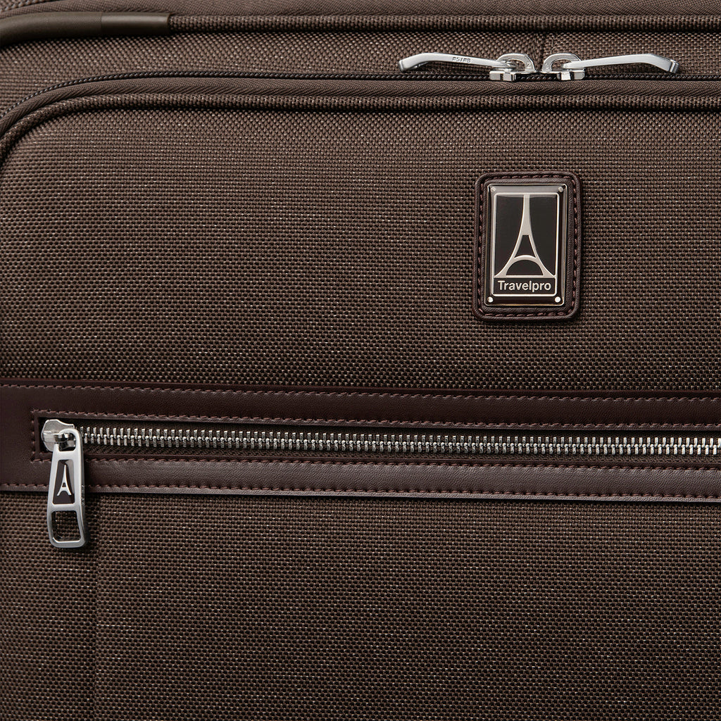 Close-up of a brown suitcase with zipper and travelpro logo
