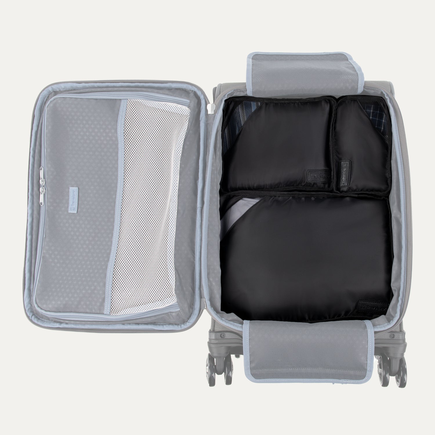 Gray suitcase with open compartment showing black packing cubes and mesh pocket on a light gray background