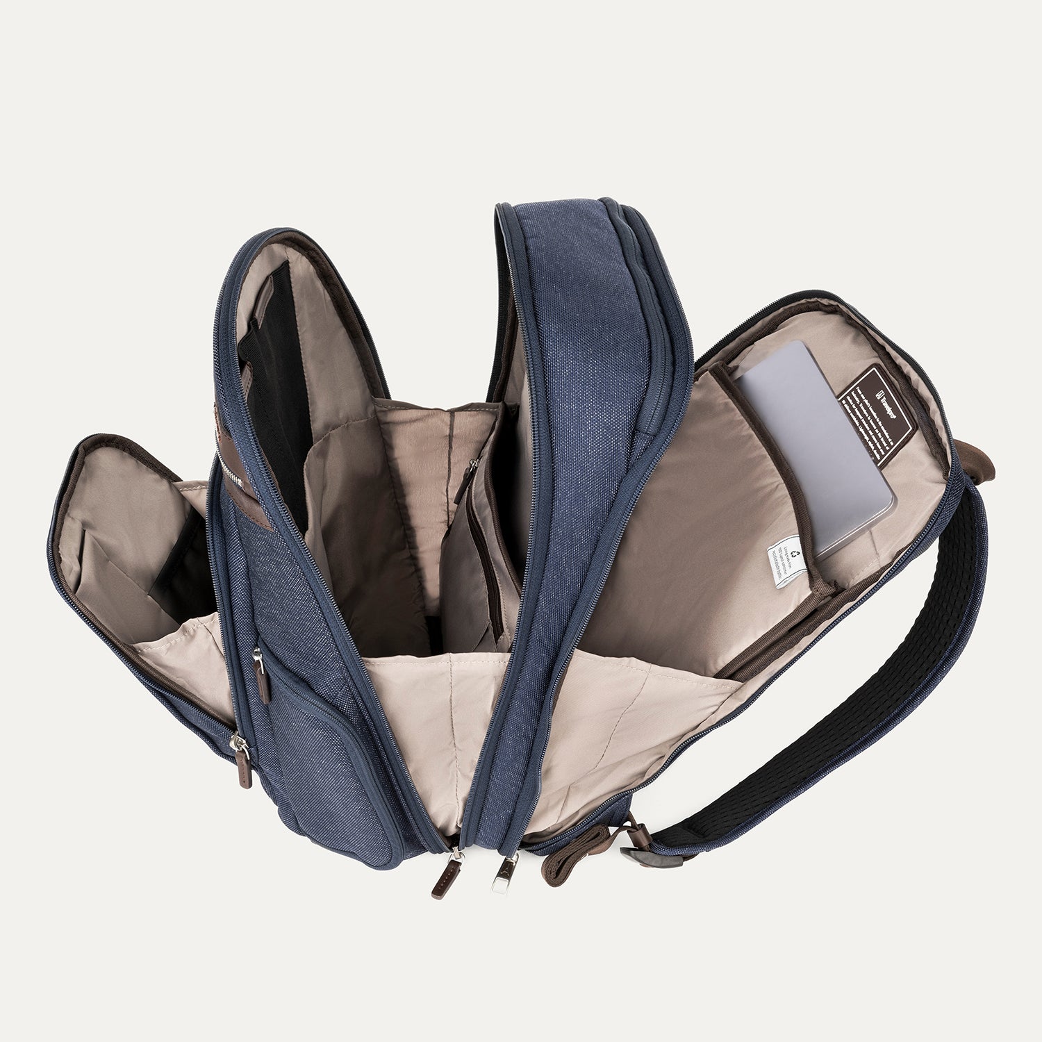 Open navy blue backpack with beige interior on a light gray background