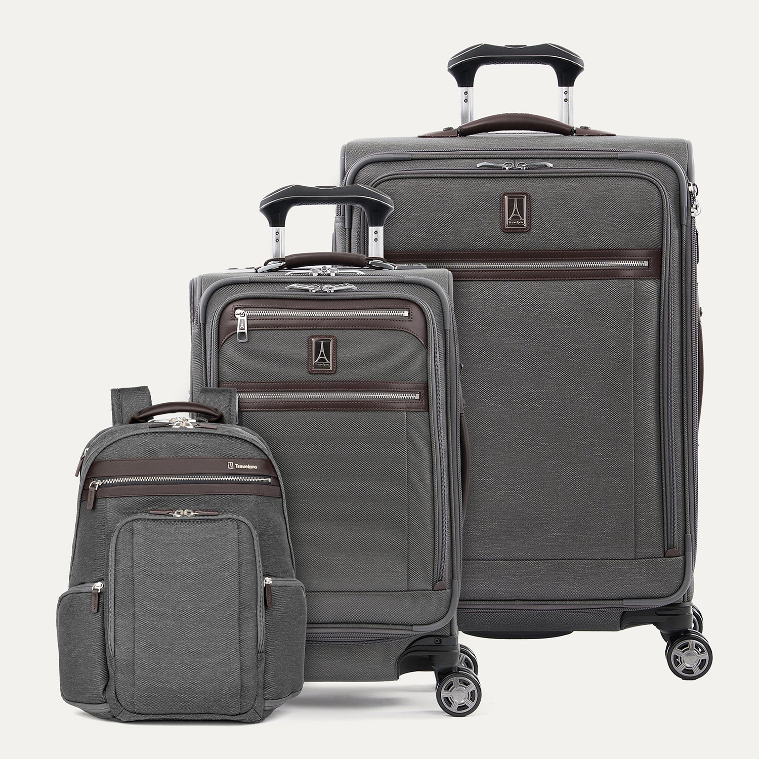Set of gray suitcases with wheels  and a backpack on a white background