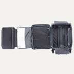 Open suitcase with compartments on a plain background