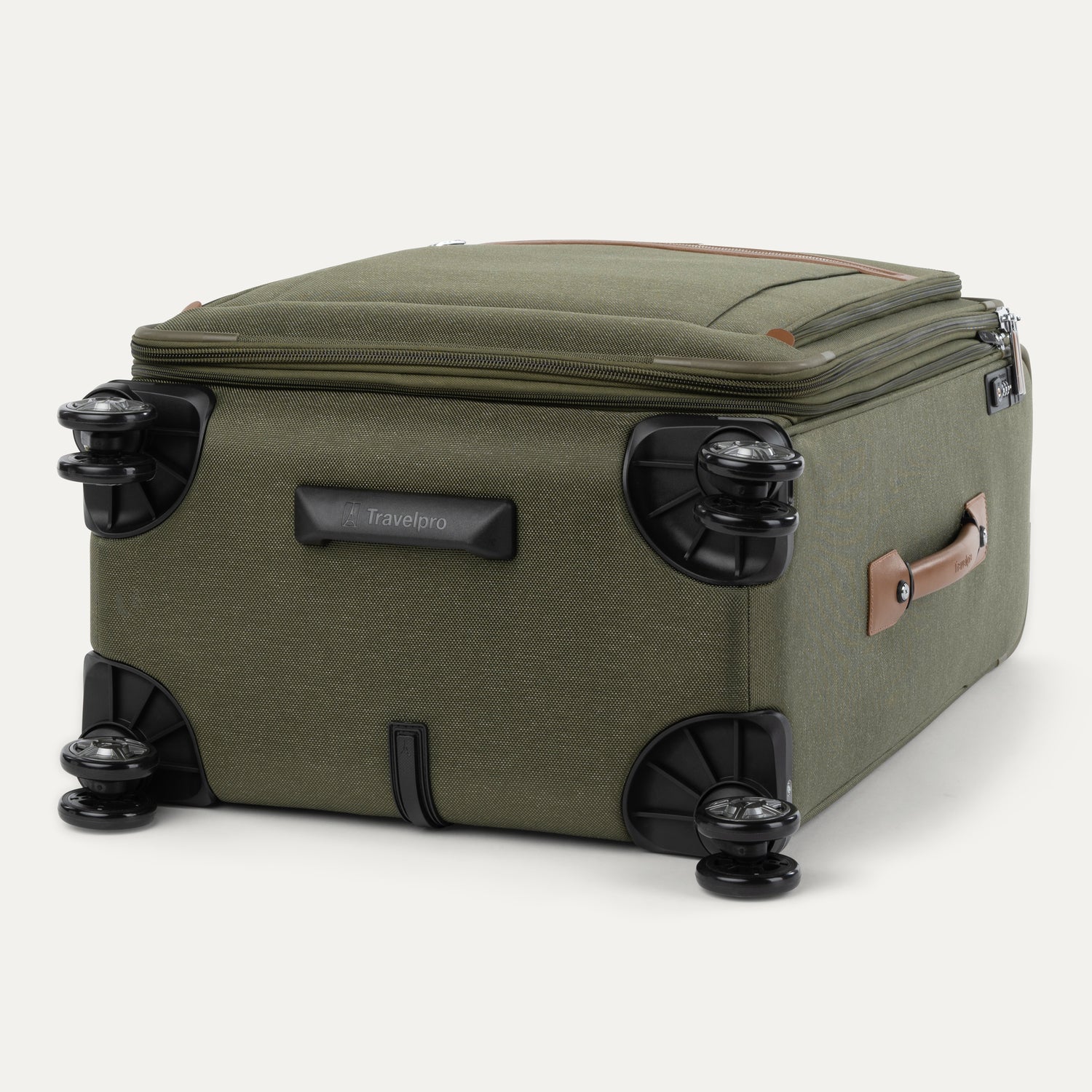Green suitcase with black wheels on a white background