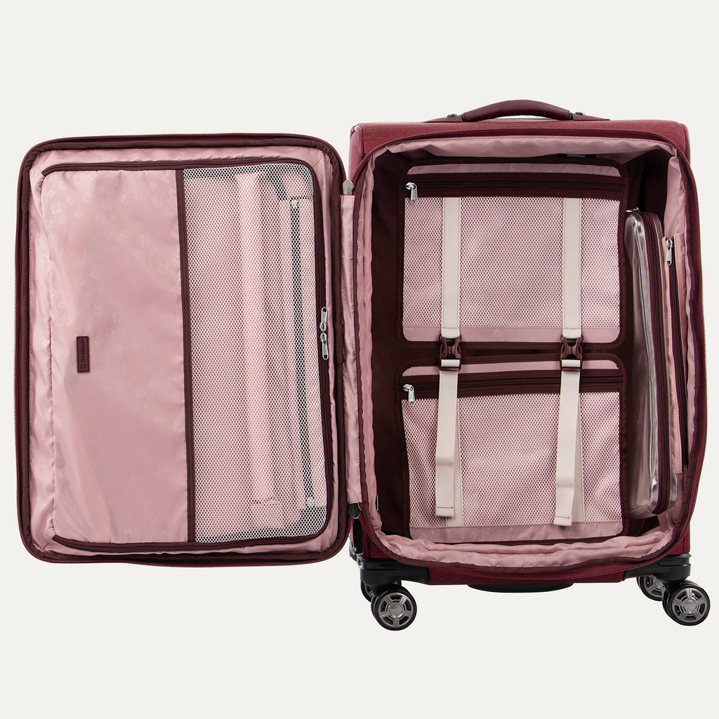 Open suitcases in bordeaux with built-in organization features and magnatrac wheels.