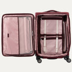Open suitcases in bordeaux with built-in organization features and magnatrac wheels.