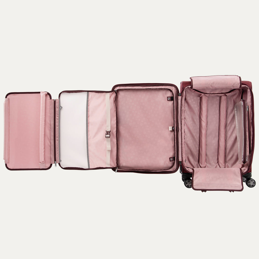 Open red suitcase with fold-out suiter on a white background