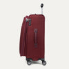 Red suitcase with wheels and handle on a white background