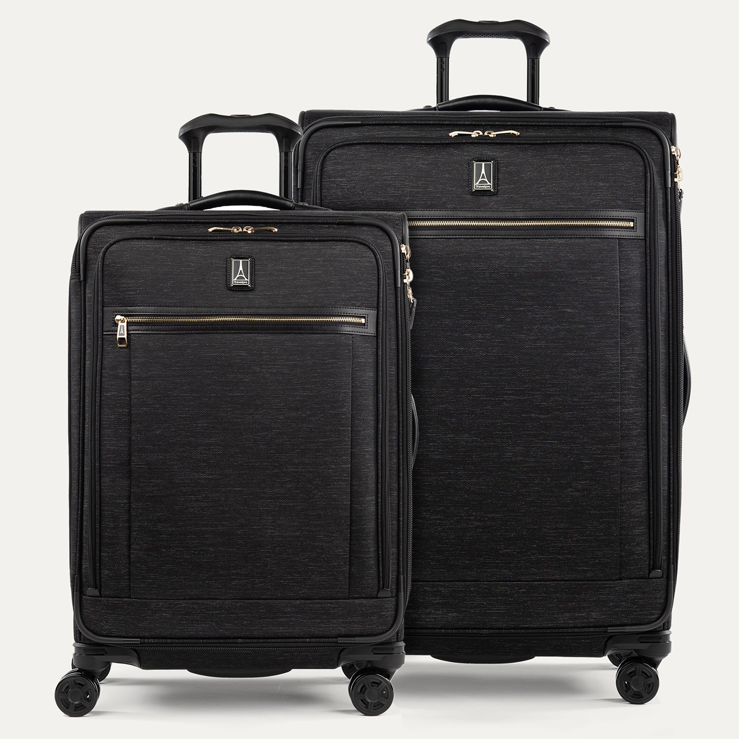 A set of two black suitcases with a spinner design, featuring the Travelpro logo on a white background