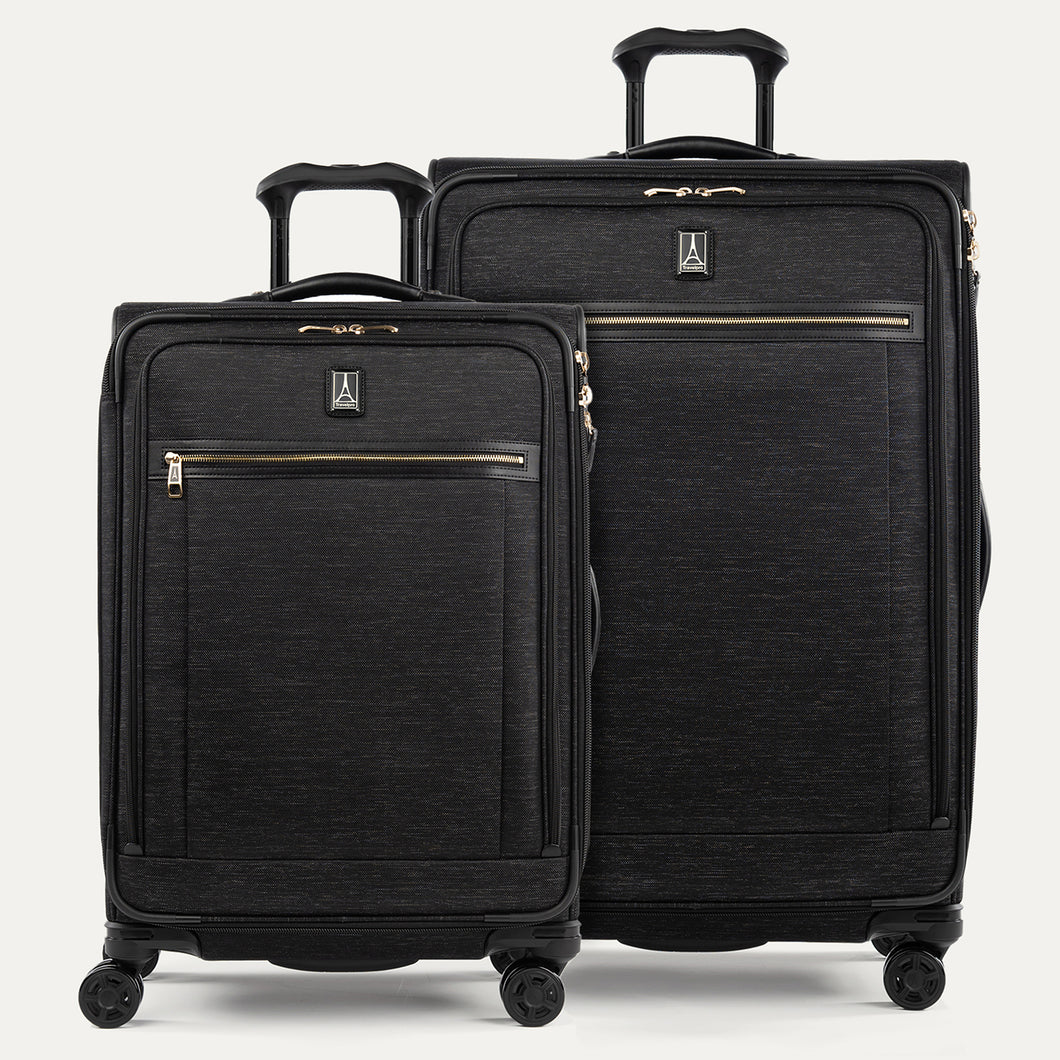 A set of two black suitcases with a spinner design, featuring the Travelpro logo on a white background