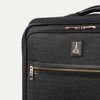 Black suitcase with gold zippers on a white background