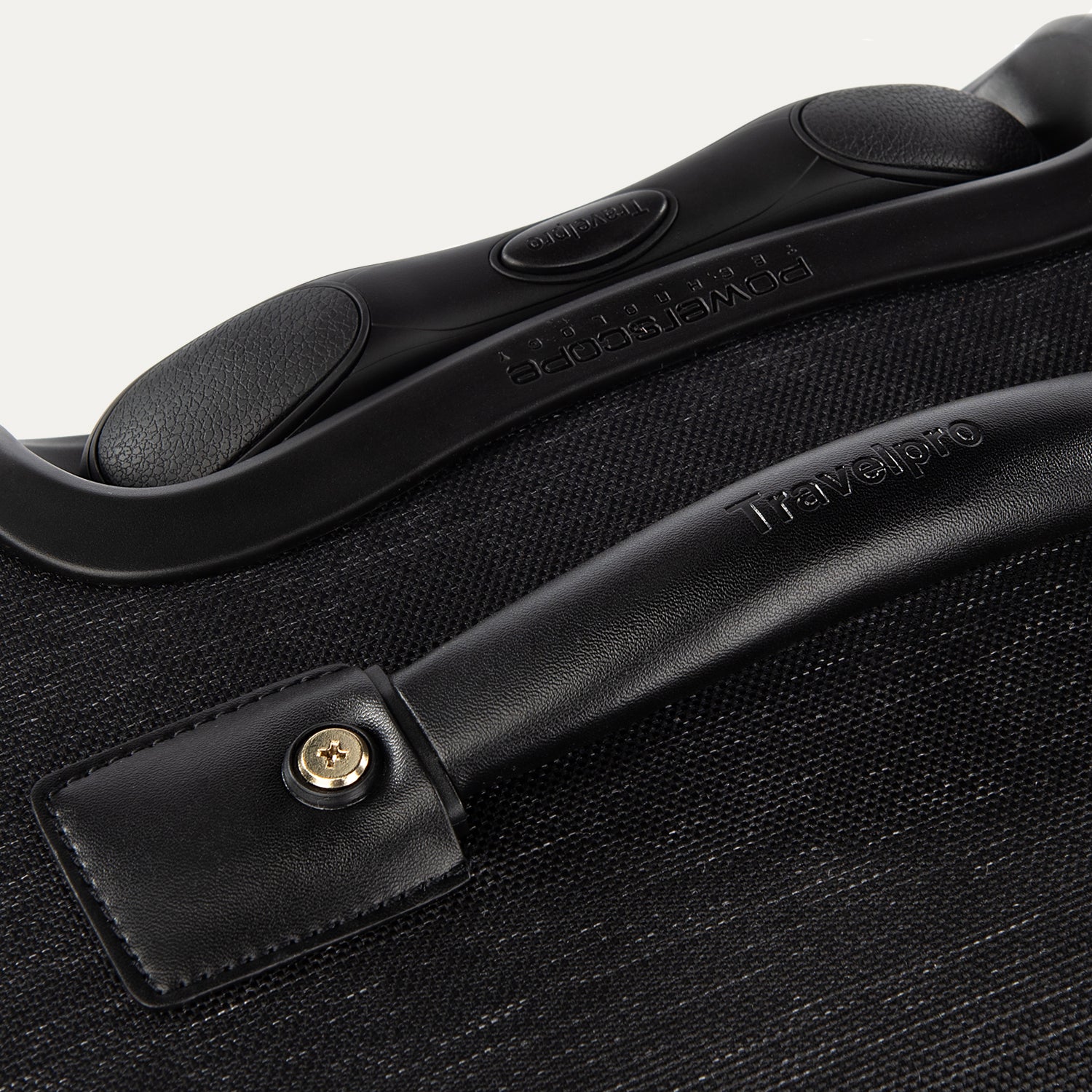 Close-up of a black suitcase handle 