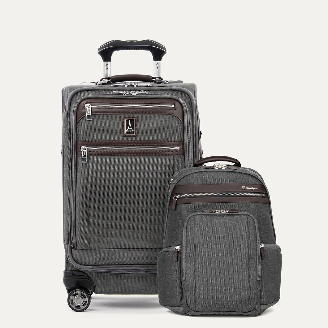 A set of travel luggage consisting of a carry-on spinner suitcase and a business backpack, both in grey color with premium fabrics and leather accents.