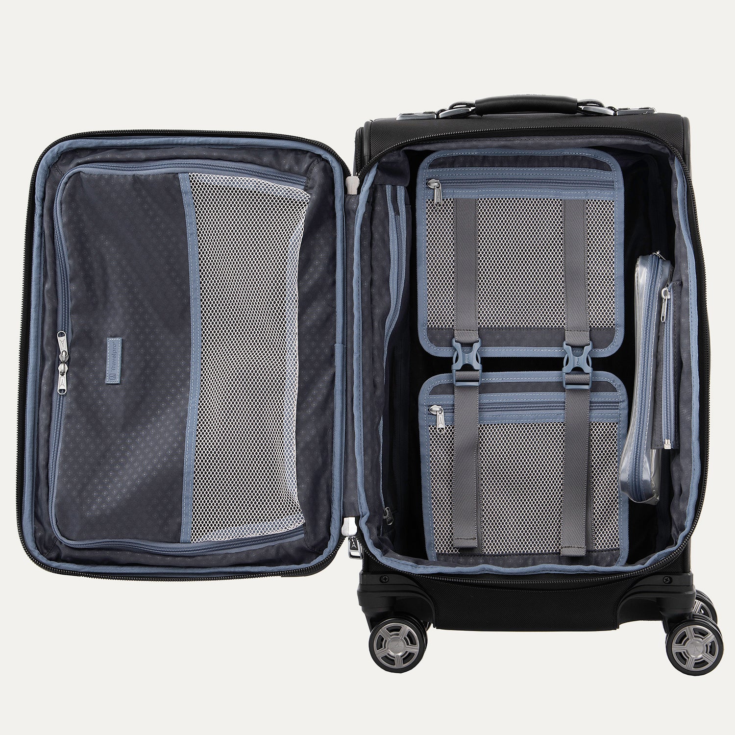 Interior view of the open Platinum Elite Carry-On Spinner in Shadow Black, showcasing the spacious split-case design with zippered mesh divider panels, a built-in fold-out suiter, and a TSA-compliant removable wet pocket.