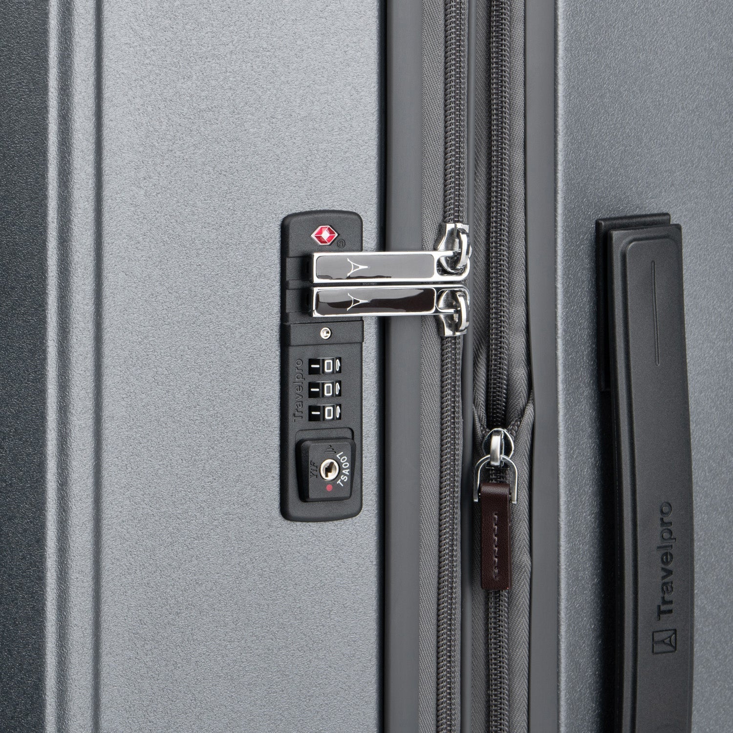 Close-up of a gray suitcase with a combination lock and Travelpro branding.
