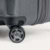 Close-up of a suitcase wheel on a white background