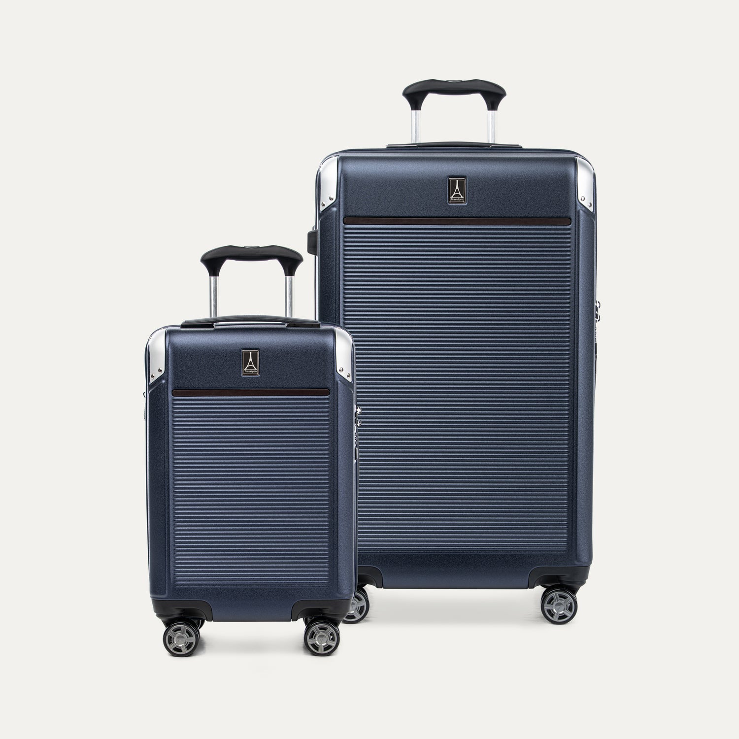 Two navy blue suitcases different sizes on a white background