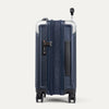 Side view of navy blue suitcase with handle and wheels on a white background